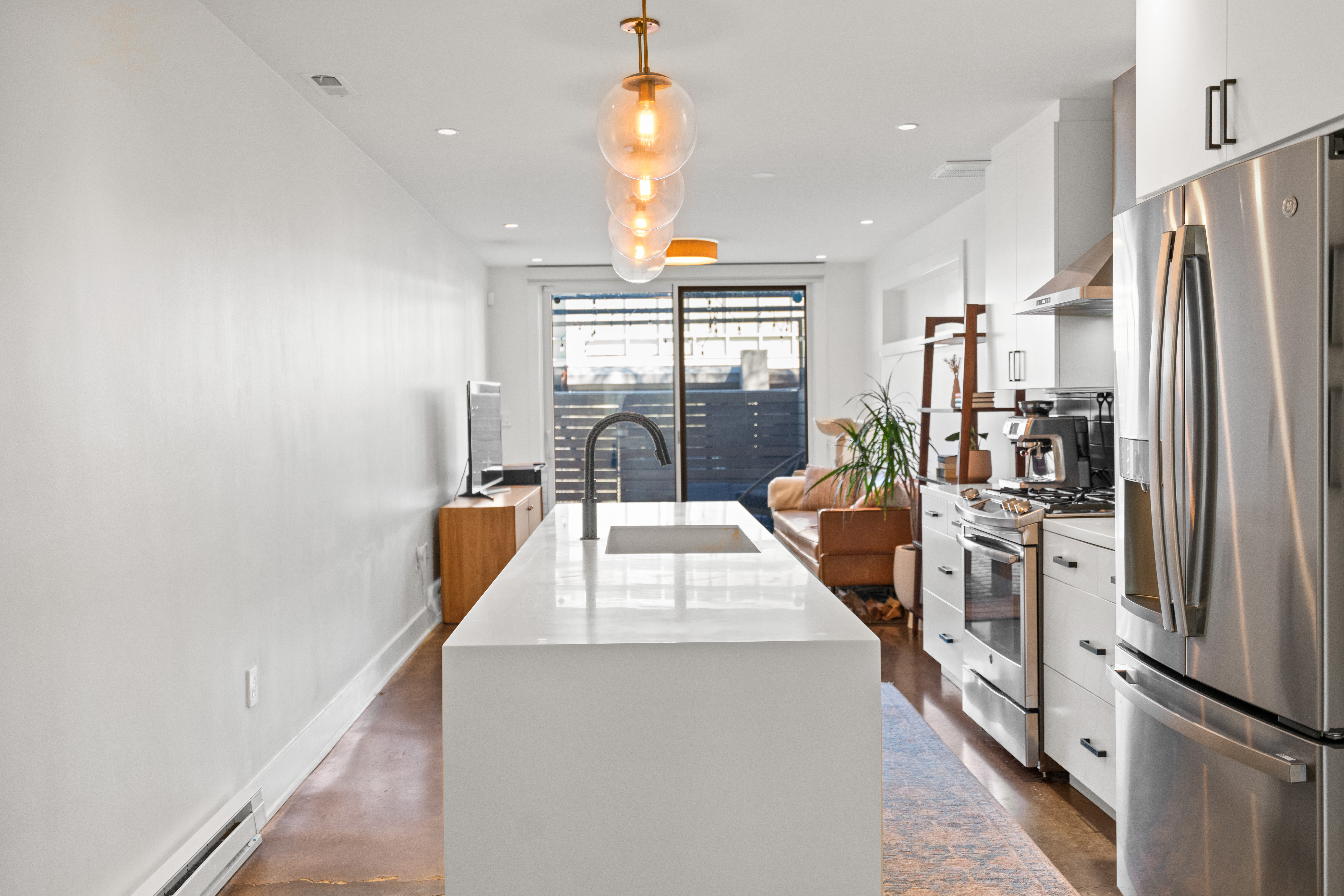 445 Ridge Street Northwest Washington, DC 20001 - Photo 8 of 43 a kitchen with stainless steel appliances a refrigerator and a stove