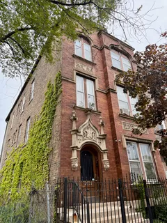 a view of a house with a iron gate