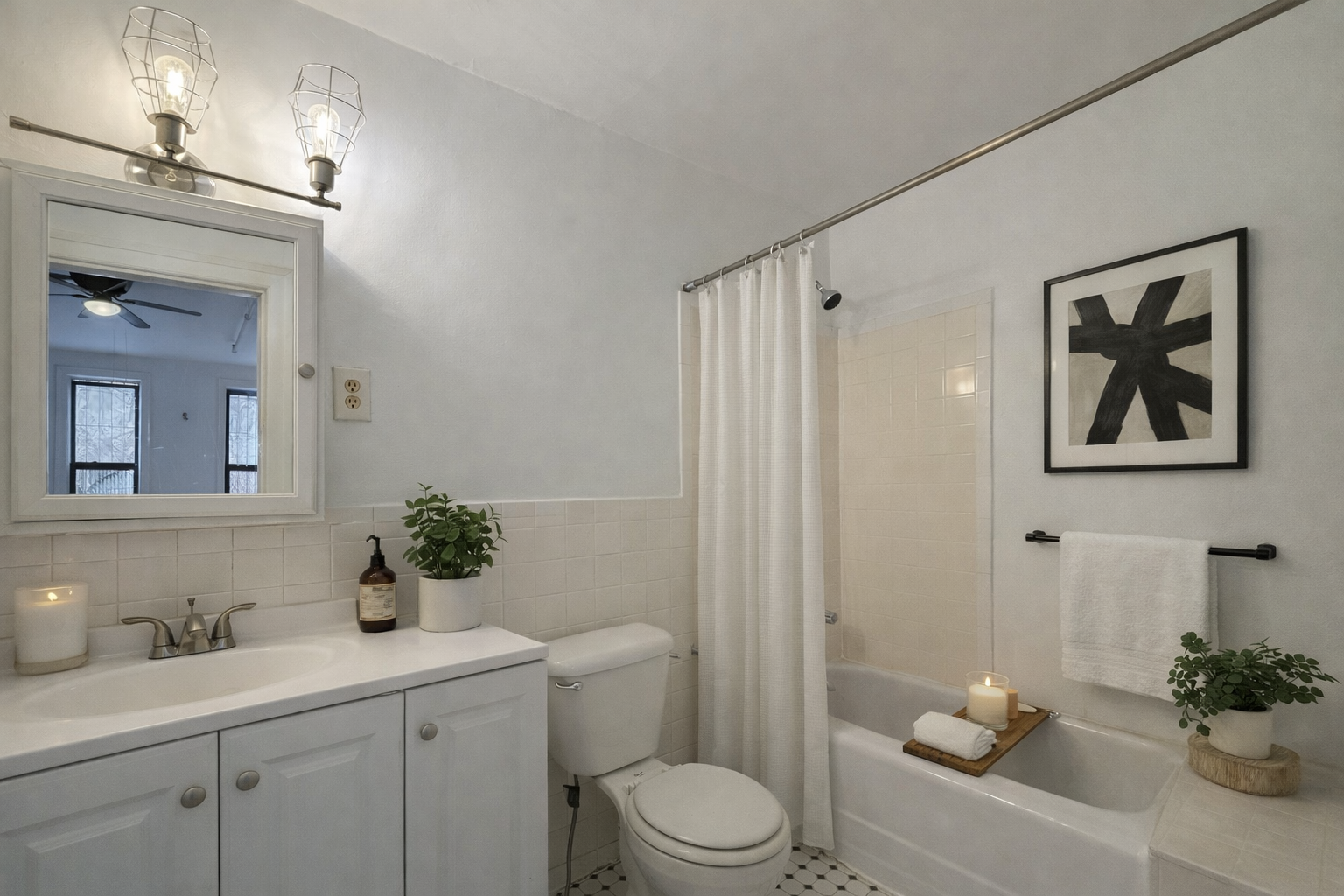 450 West 145th Street, Unit 2 Manhattan, NY 10031 - Photo 2 of 3 a bathroom with a toilet a sink and mirror