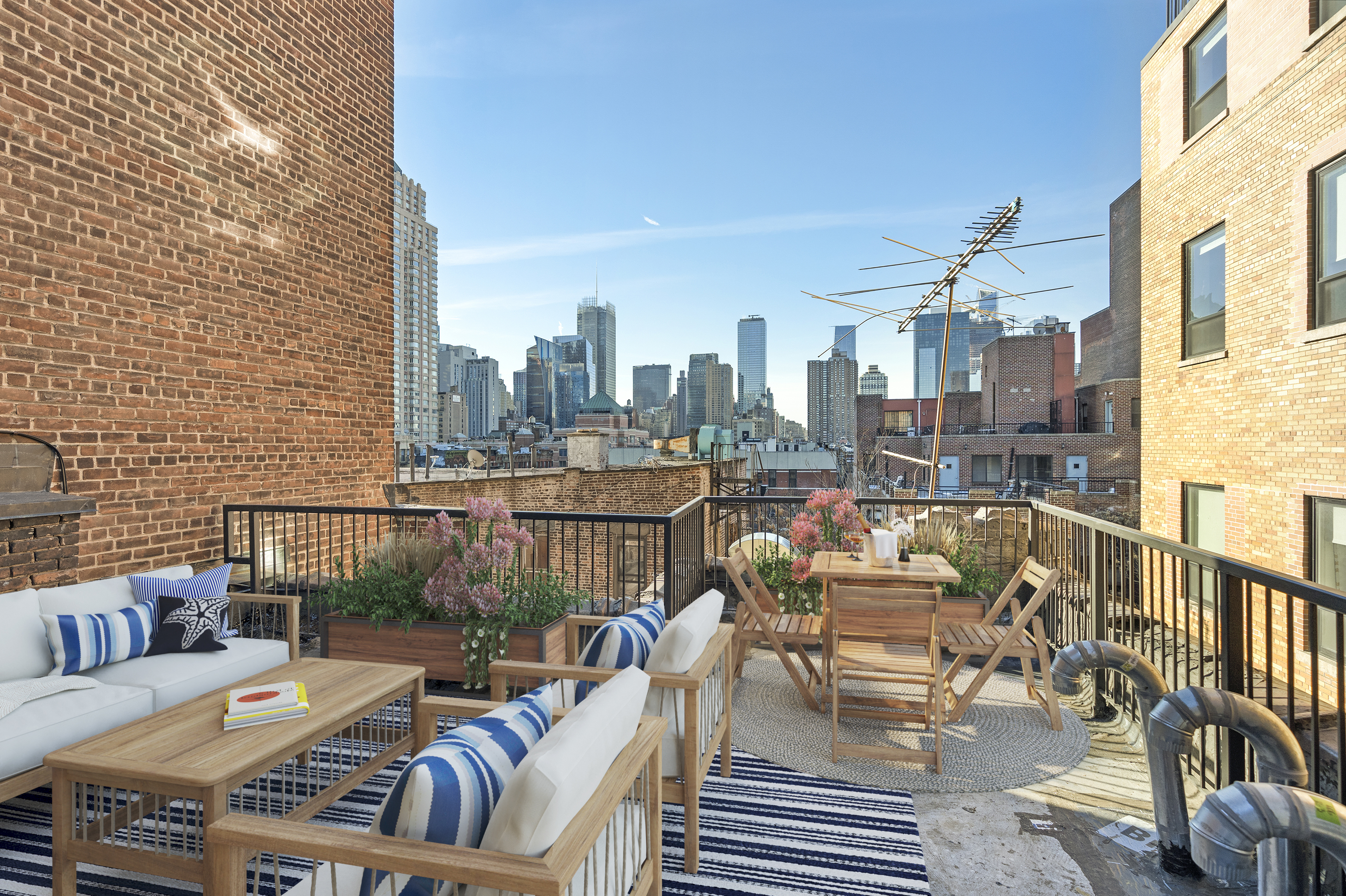406 West 52nd Street, Unit 2 Manhattan, NY 10019 - Photo 9 of 9 a view of a balcony with furniture