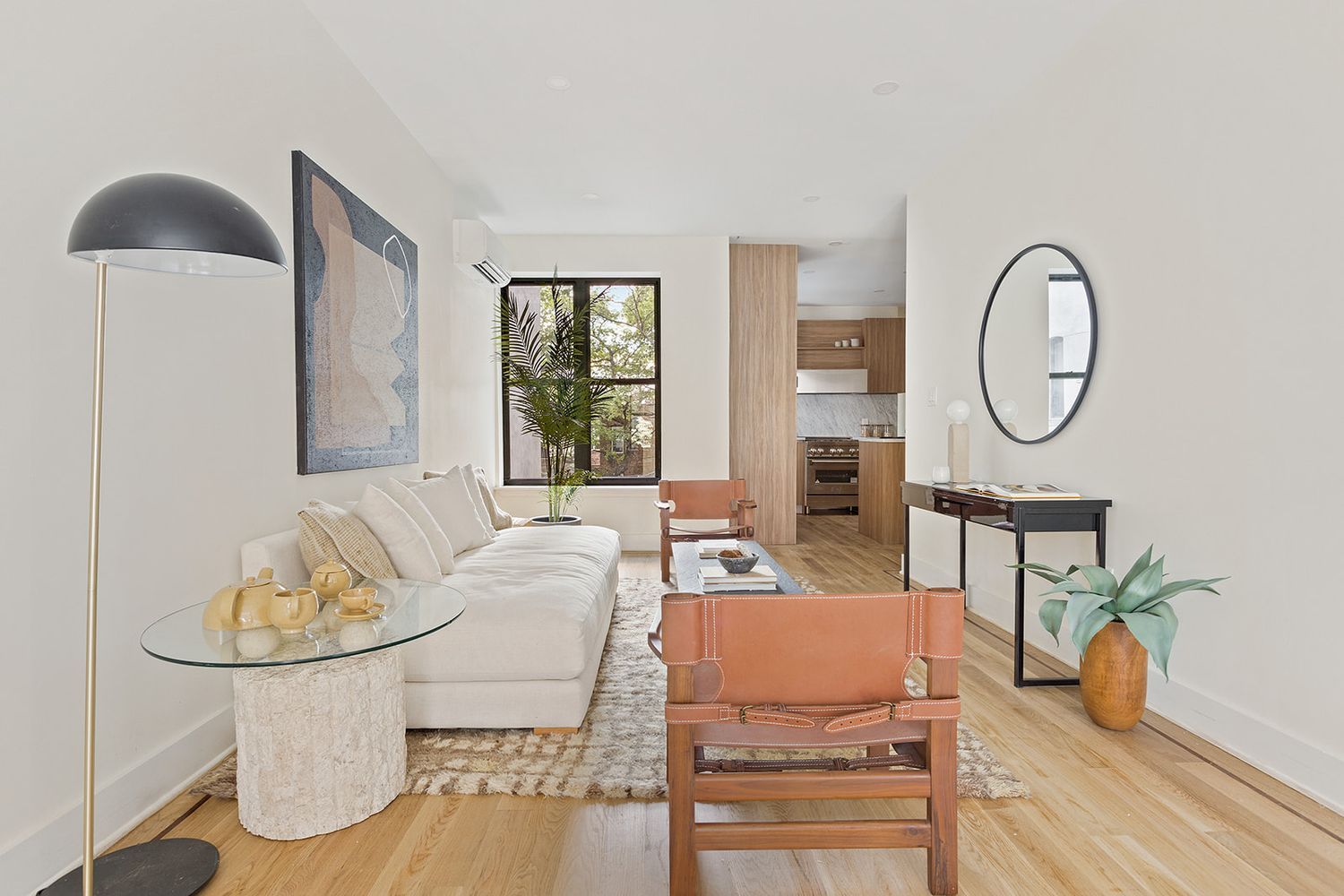 917 Saint Marks Avenue, Unit 3 Brooklyn, NY 11213 - Photo 2 of 12 a living room with furniture a table and wooden floor
