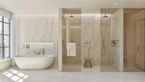 a spacious bathroom with a bathtub and shower