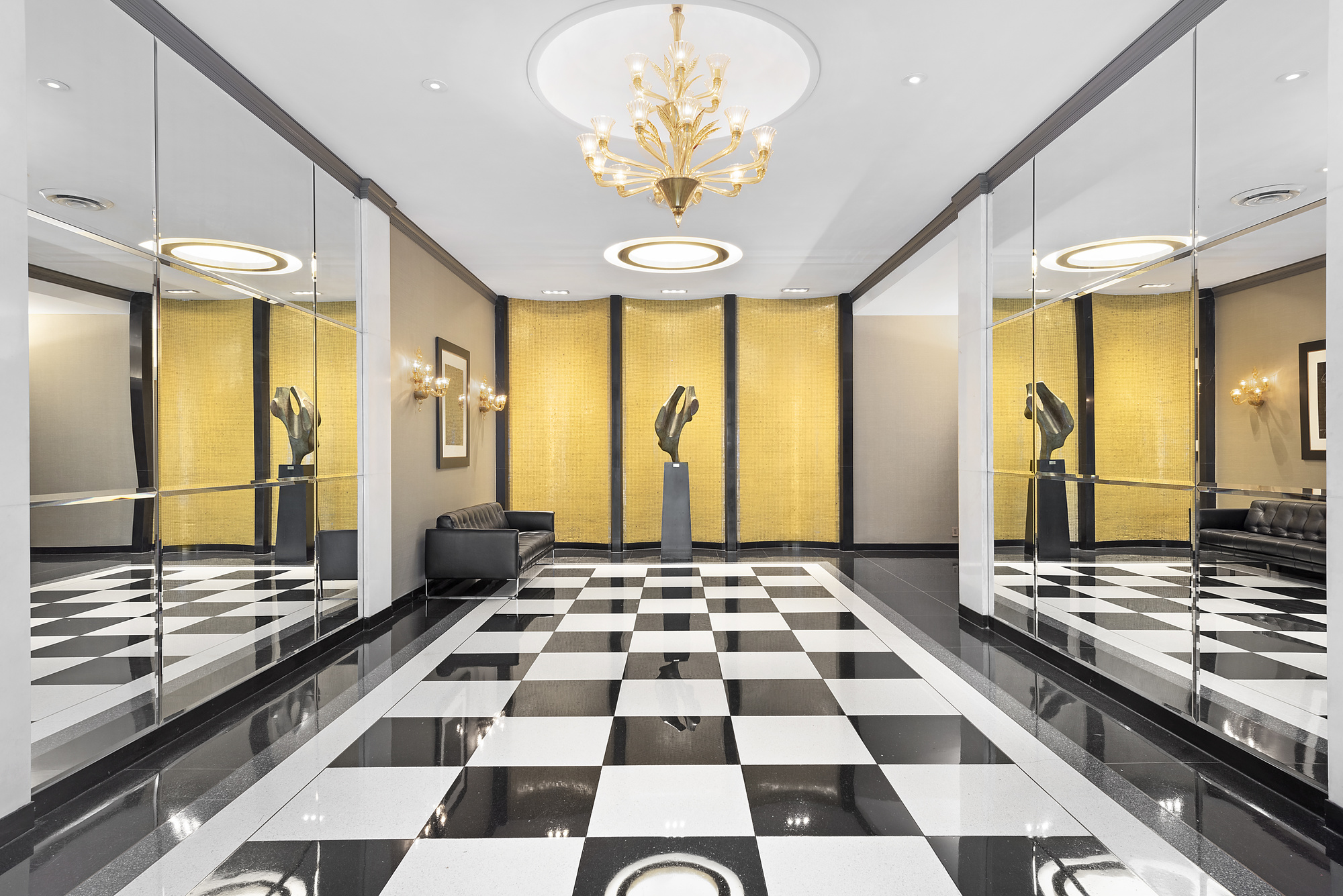 165 East 72nd Street, Unit 3L Manhattan, NY 10021 - Photo 11 of 13 a kitchen with stainless steel appliances granite countertop a sink and a stove