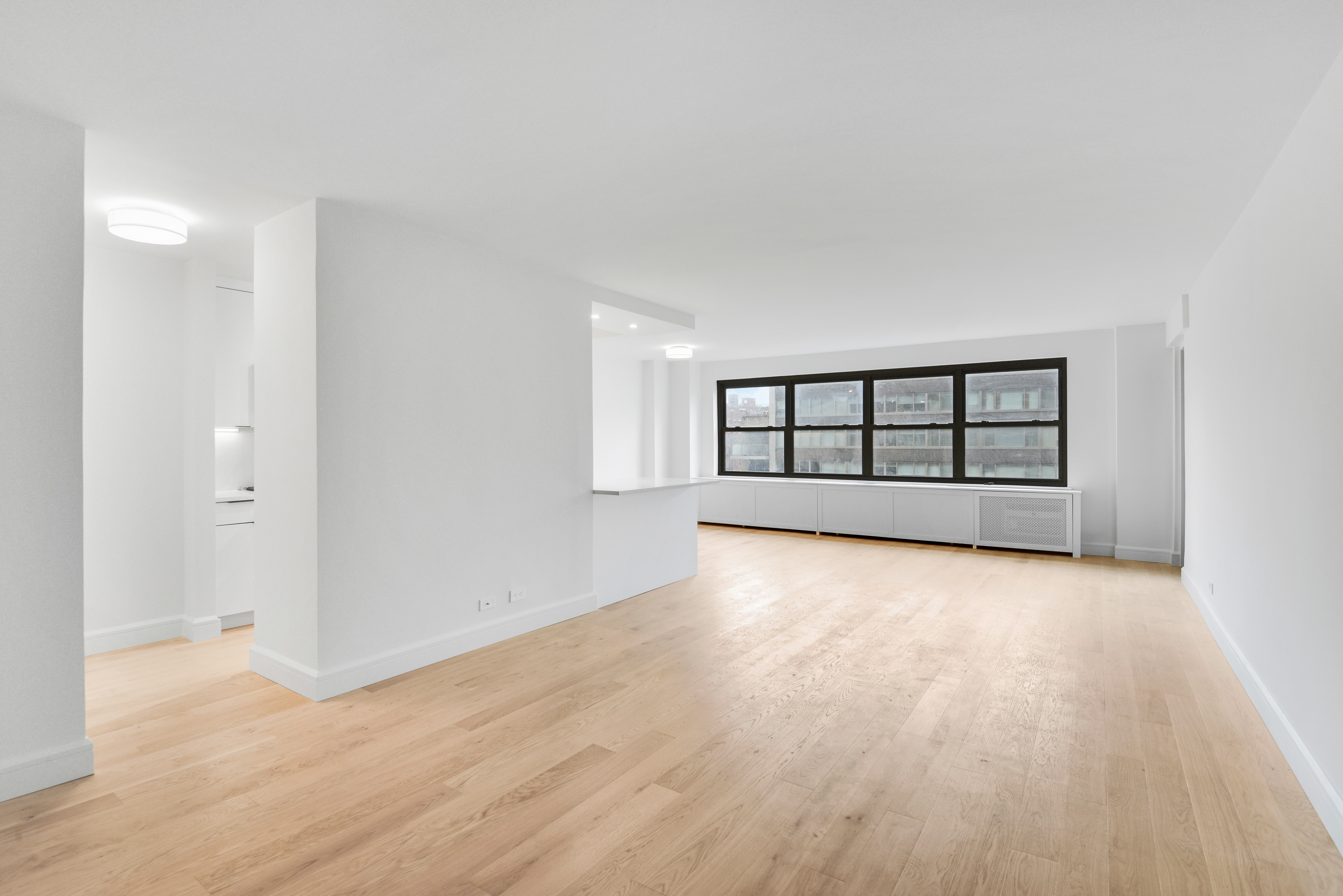 205 West End Avenue, Unit 15H Manhattan, NY 10023 - Photo 4 of 17 wooden floor in an empty room with a window