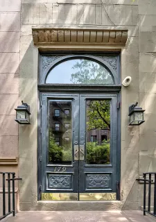 a view of a hallway with wooden floor and entryway