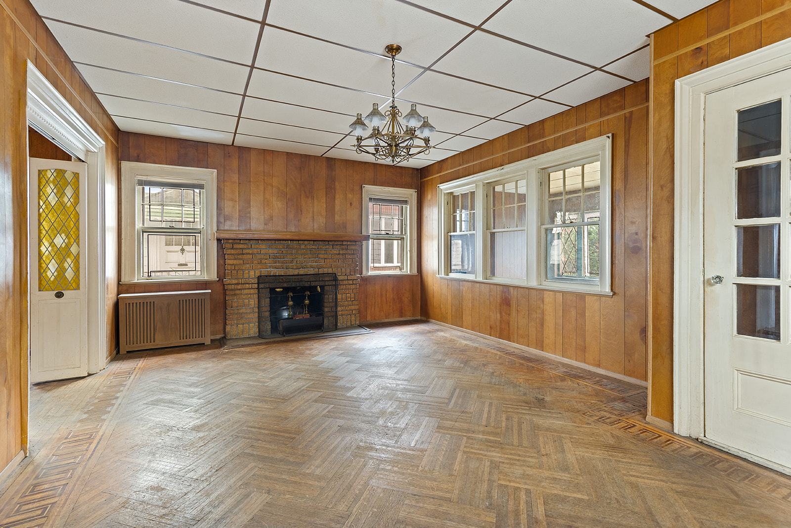 2411 Avenue M Brooklyn, NY 11210 - Photo 3 of 12 a view of an empty room with a window and a kitchen