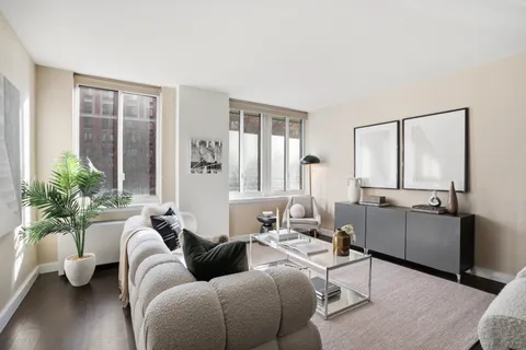a living room with furniture and a window