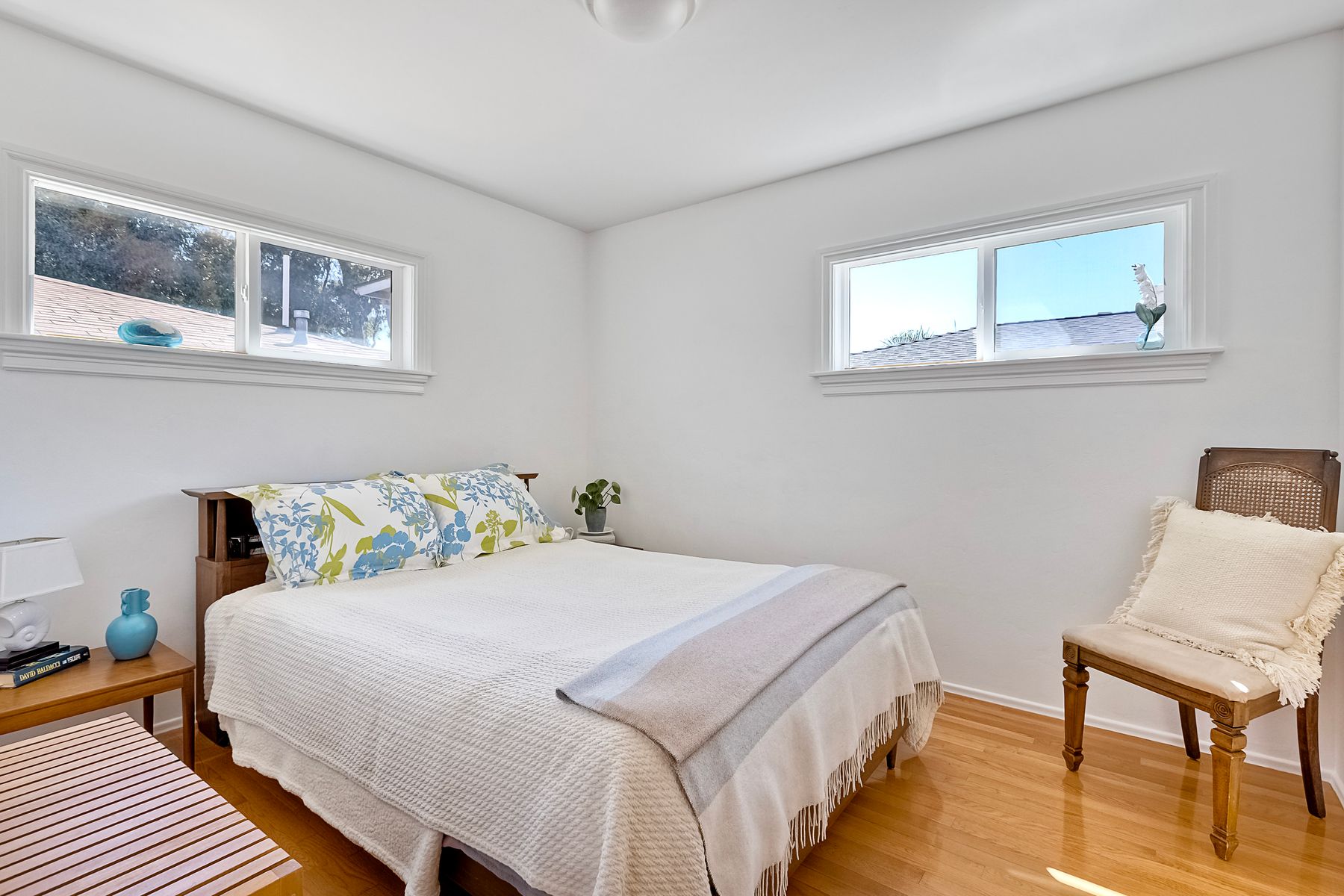 534 Hoover Street Oceanside, CA 92054 - Photo 20 of 31 a bedroom with a bed and wooden floor