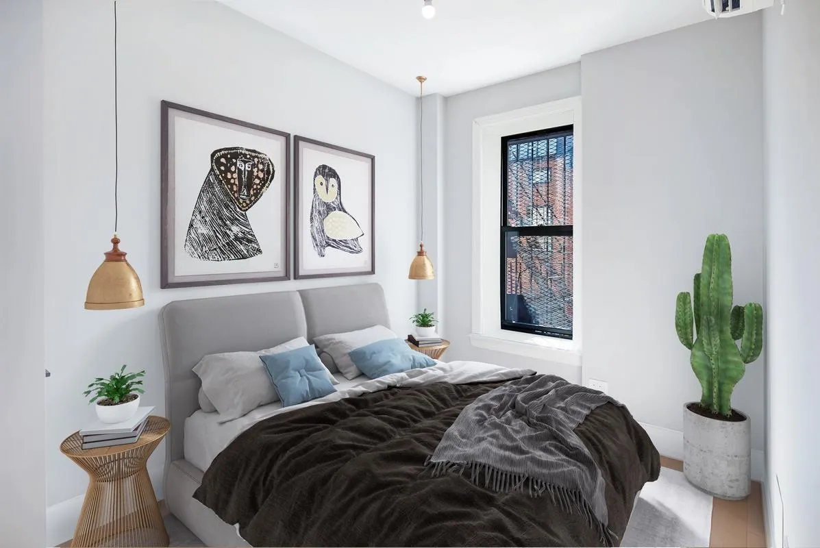 a bedroom with a bed and painting on the wall