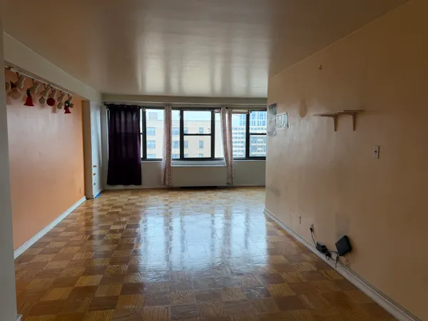 a view of an empty room with a window