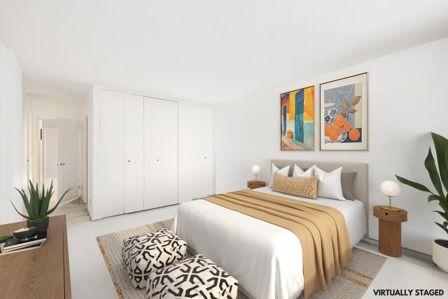 a bedroom with a large bed and a painting on the wall