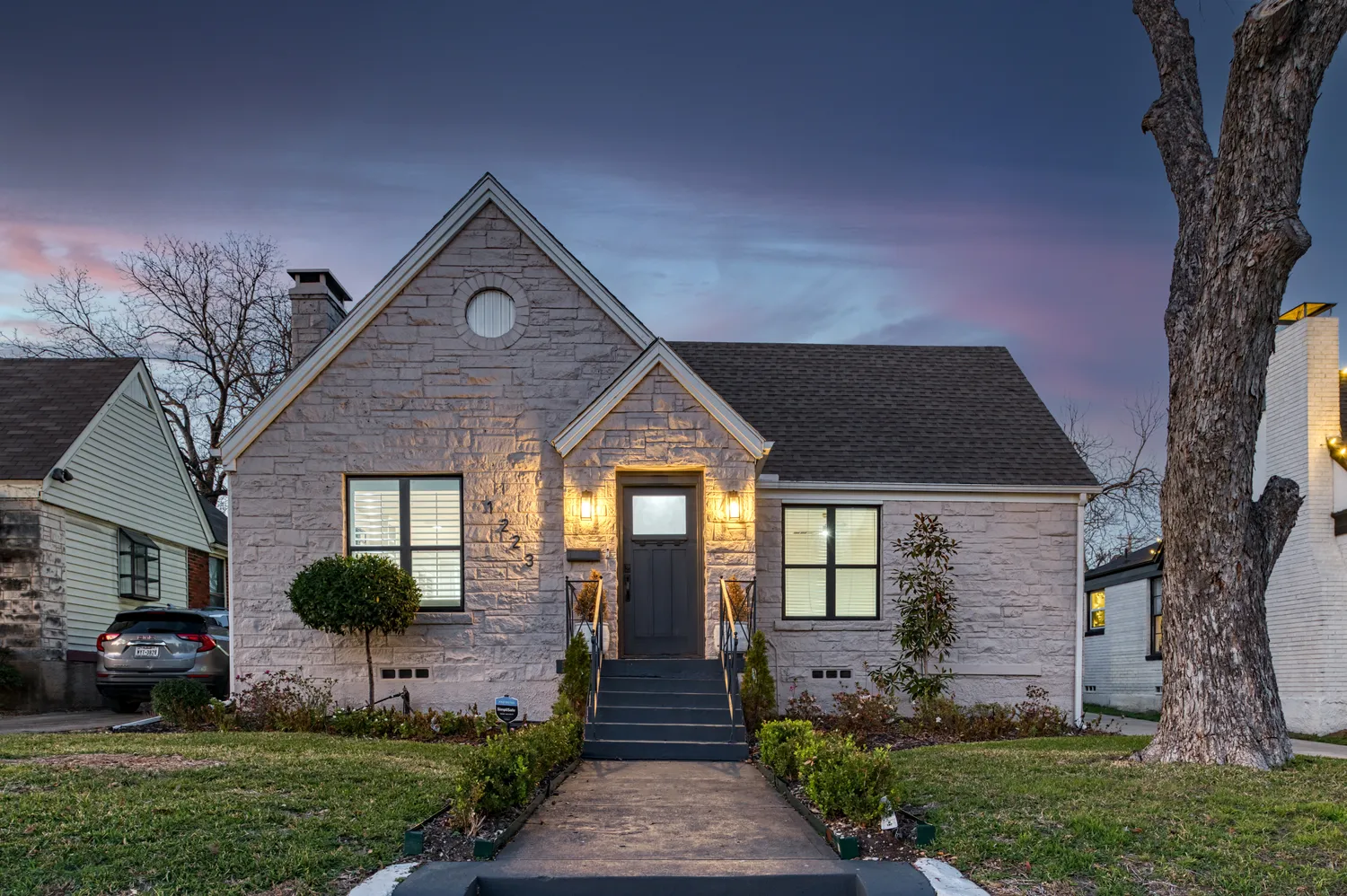 a front view of a house with garden