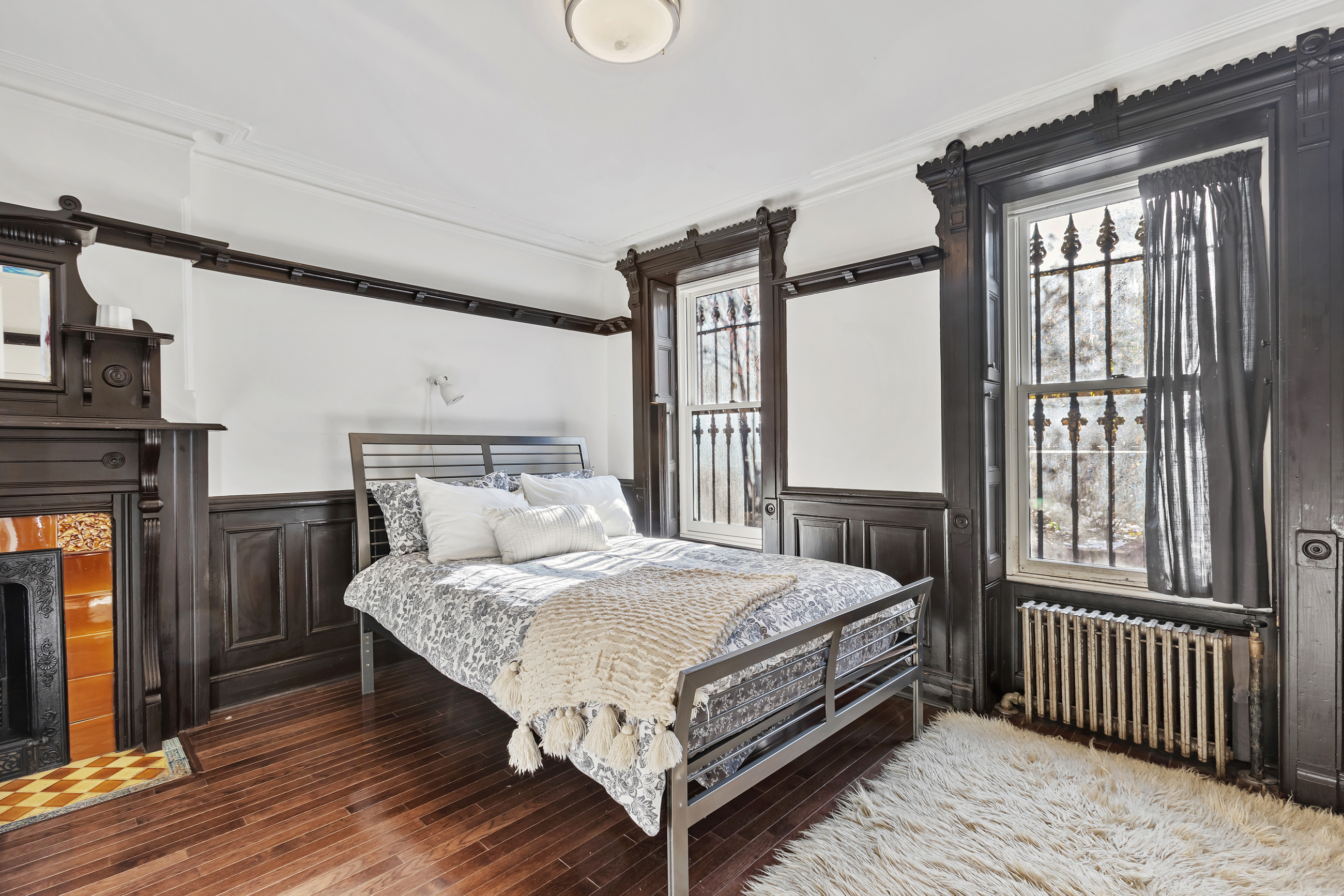 595 Madison Street, Unit GARDEN Brooklyn, NY 11221 - Photo 2 of 9 a bedroom with a bed and a window