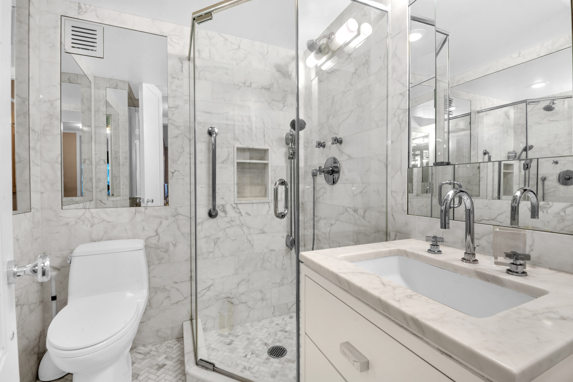 150 East 69th Street, Unit 6Q Manhattan, NY 10021 - Photo 13 of 15 a bathroom with a sink toilet and shower