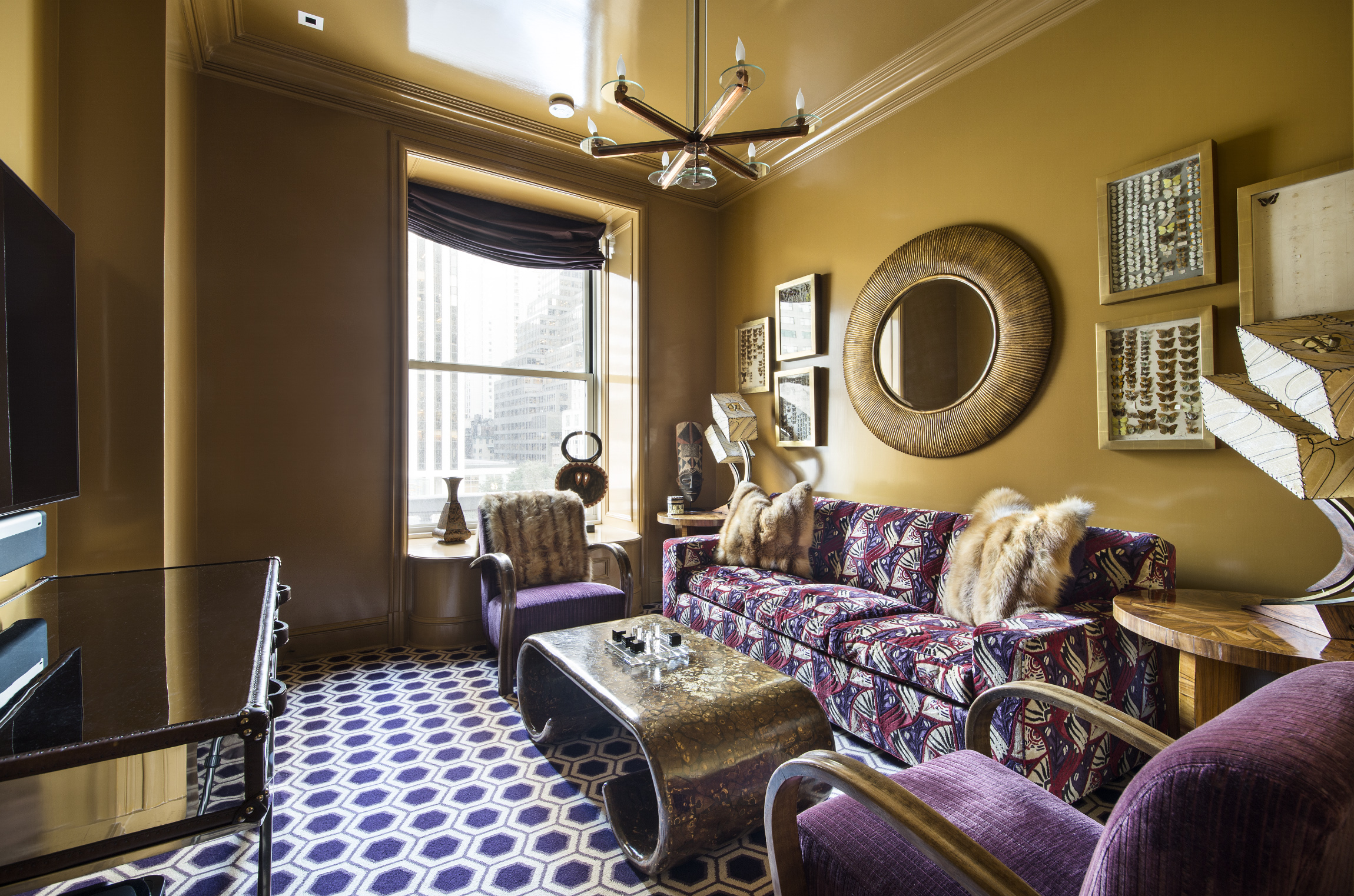 1 Central Park South, Unit 409 Manhattan, NY 10019 - Photo 9 of 26 a living room with furniture a rug and a chandelier