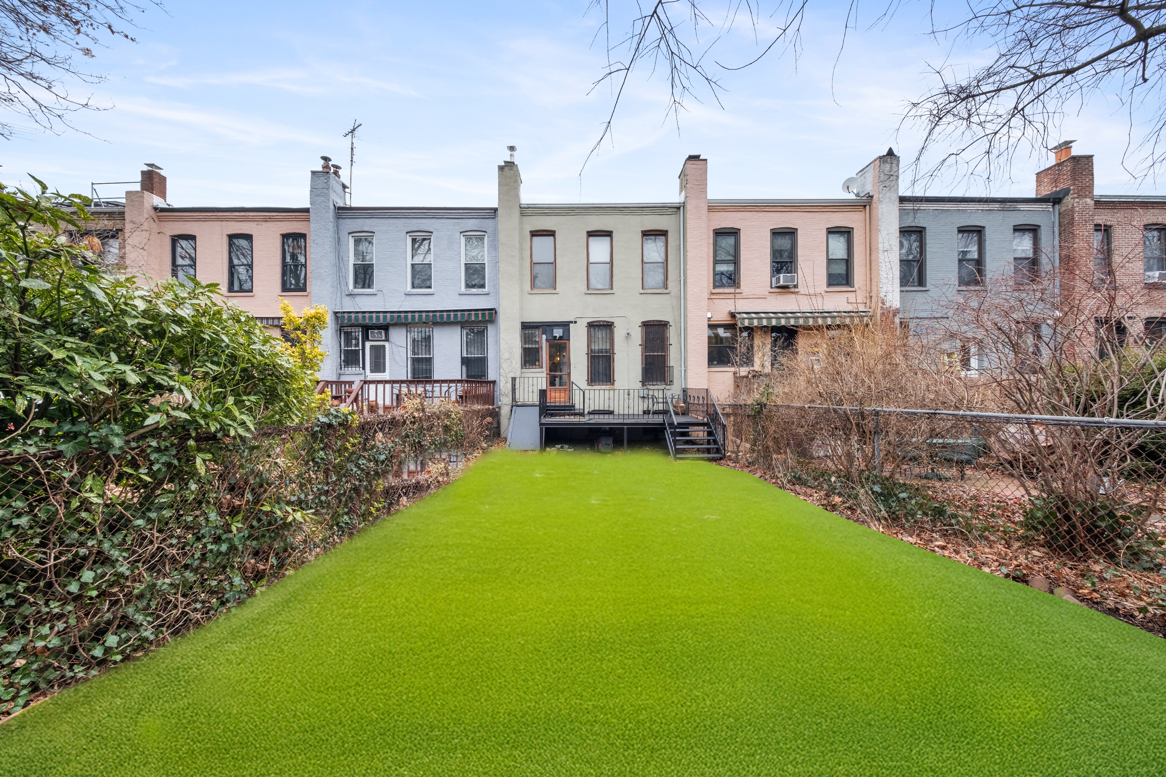 196 Maple Street Brooklyn, NY 11225 - Photo 22 of 31 a front view of a house with a yard table and chairs