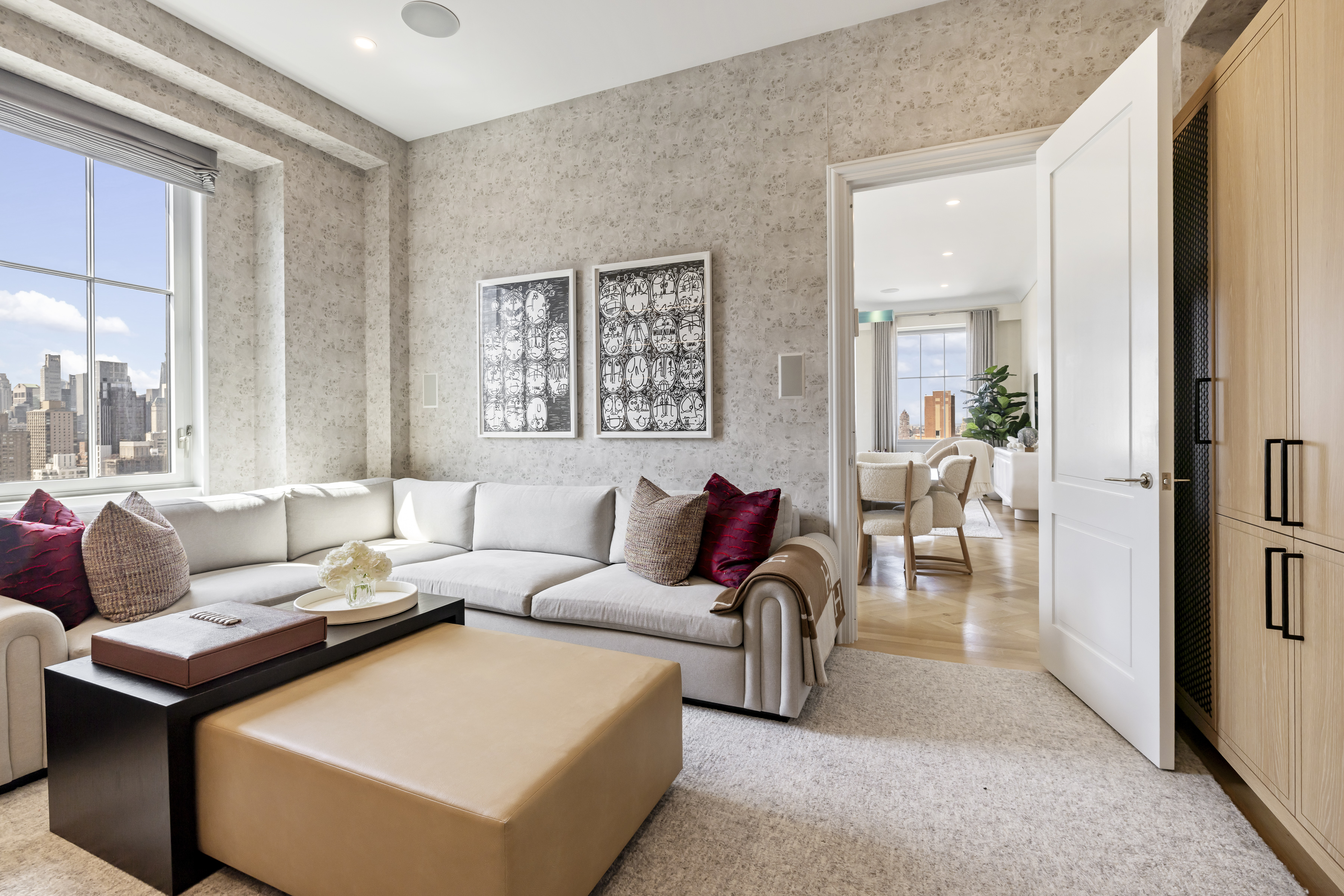 301 East 80th Street, Unit 25B Manhattan, NY 10075 - Photo 7 of 38 a living room with furniture and a large window