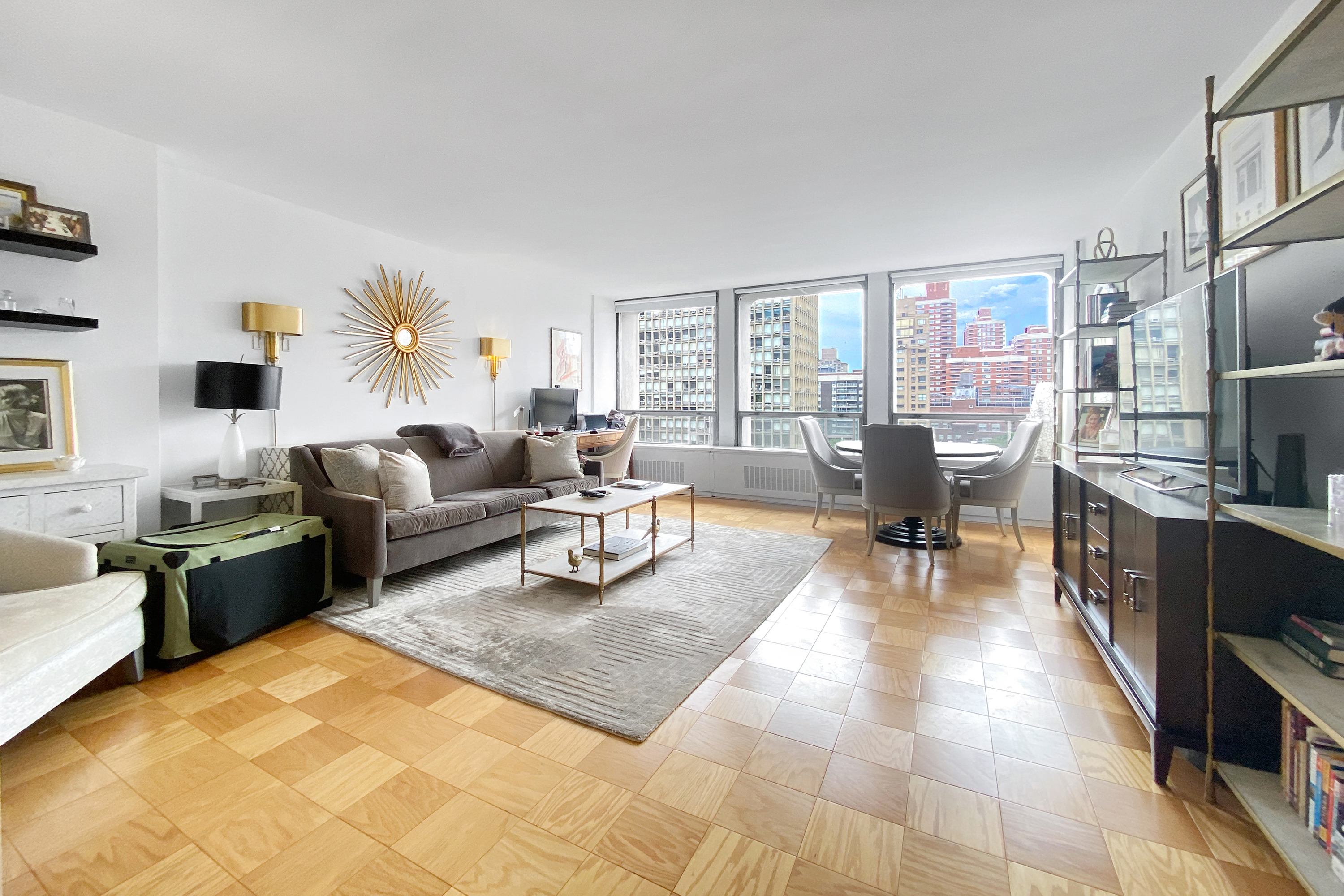 300 East 33rd Street, Unit 10A Manhattan, NY 10016 - Photo 2 of 14 a living room with furniture large window and a table