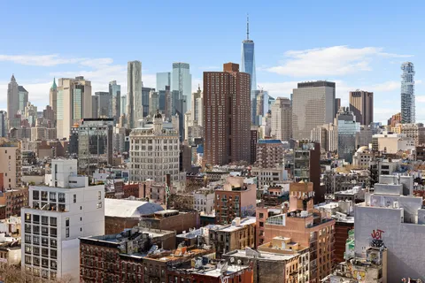 a view of city with tall buildings