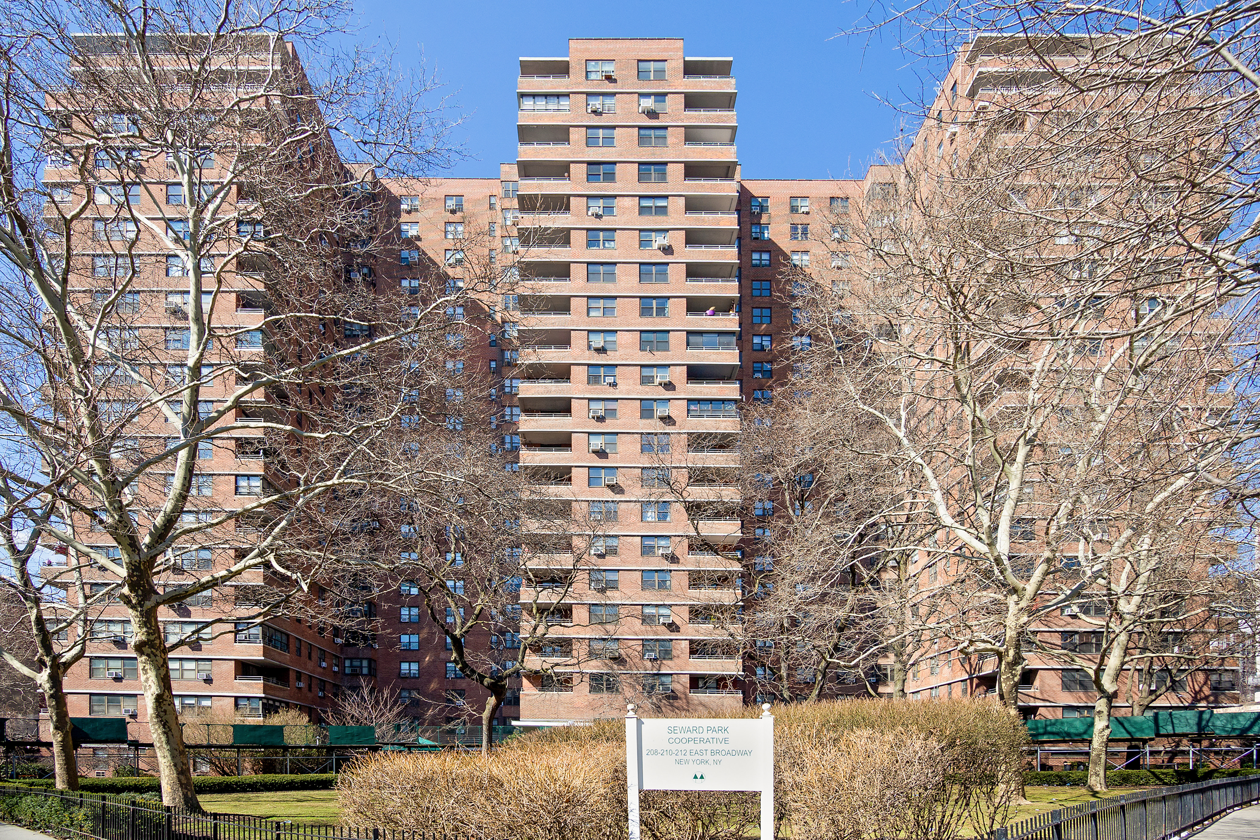 385 Grand Street, Unit L207 Manhattan, NY 10002 - Photo 11 of 12 front view of a building with a street