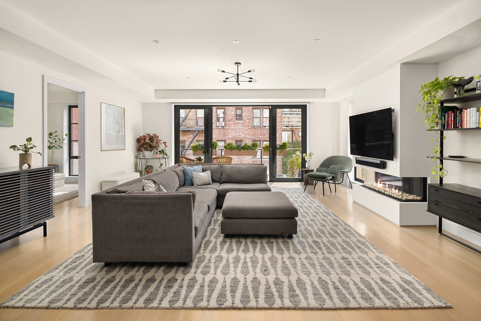 134 West 83rd Street, Unit 4 Manhattan, NY 10024 - Photo 2 of 17 a living room with furniture and a flat screen tv