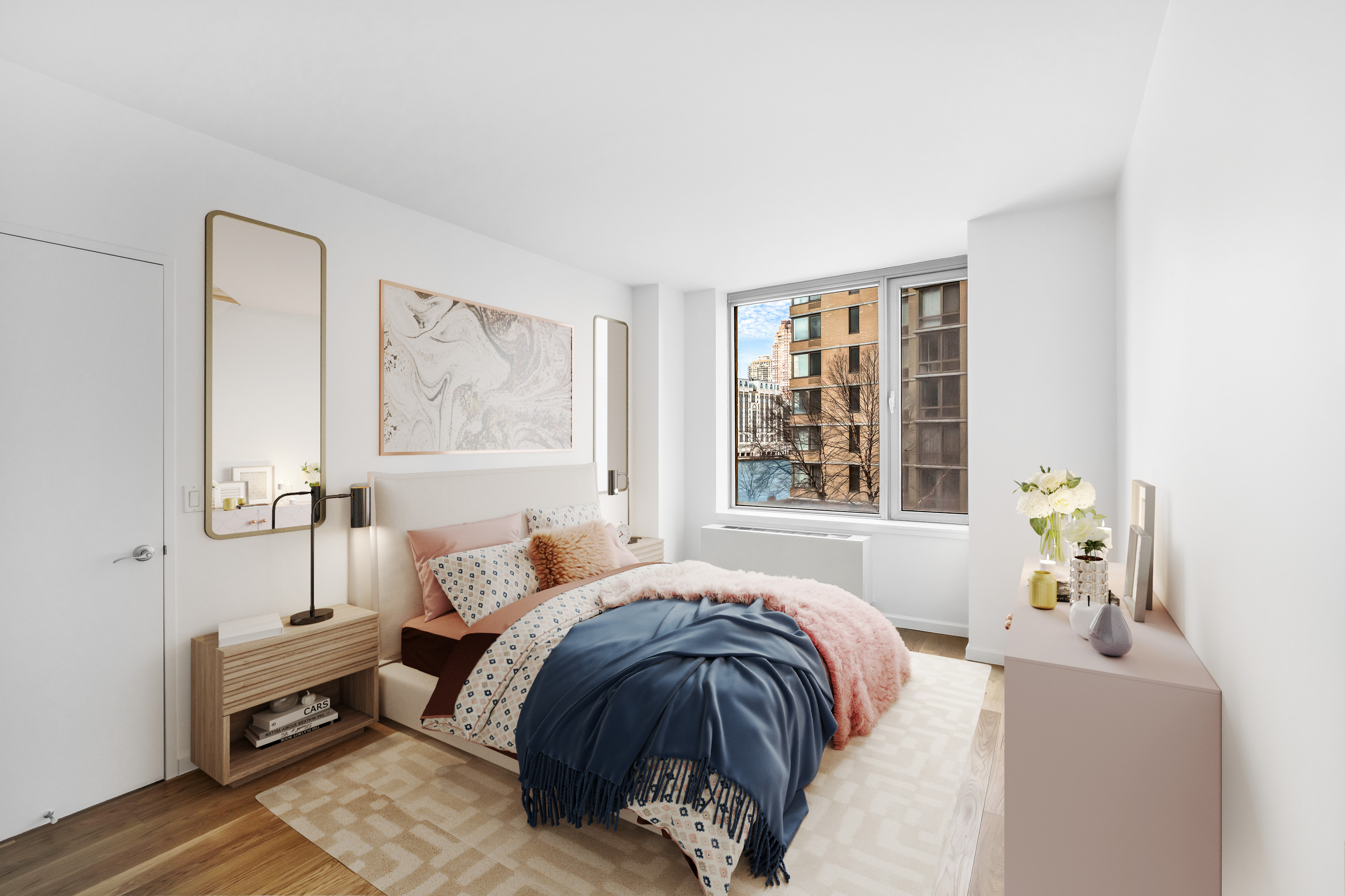 455 Main Street, Unit 5K Manhattan, NY 10044 - Photo 6 of 12 a bedroom with a bed and wooden floor