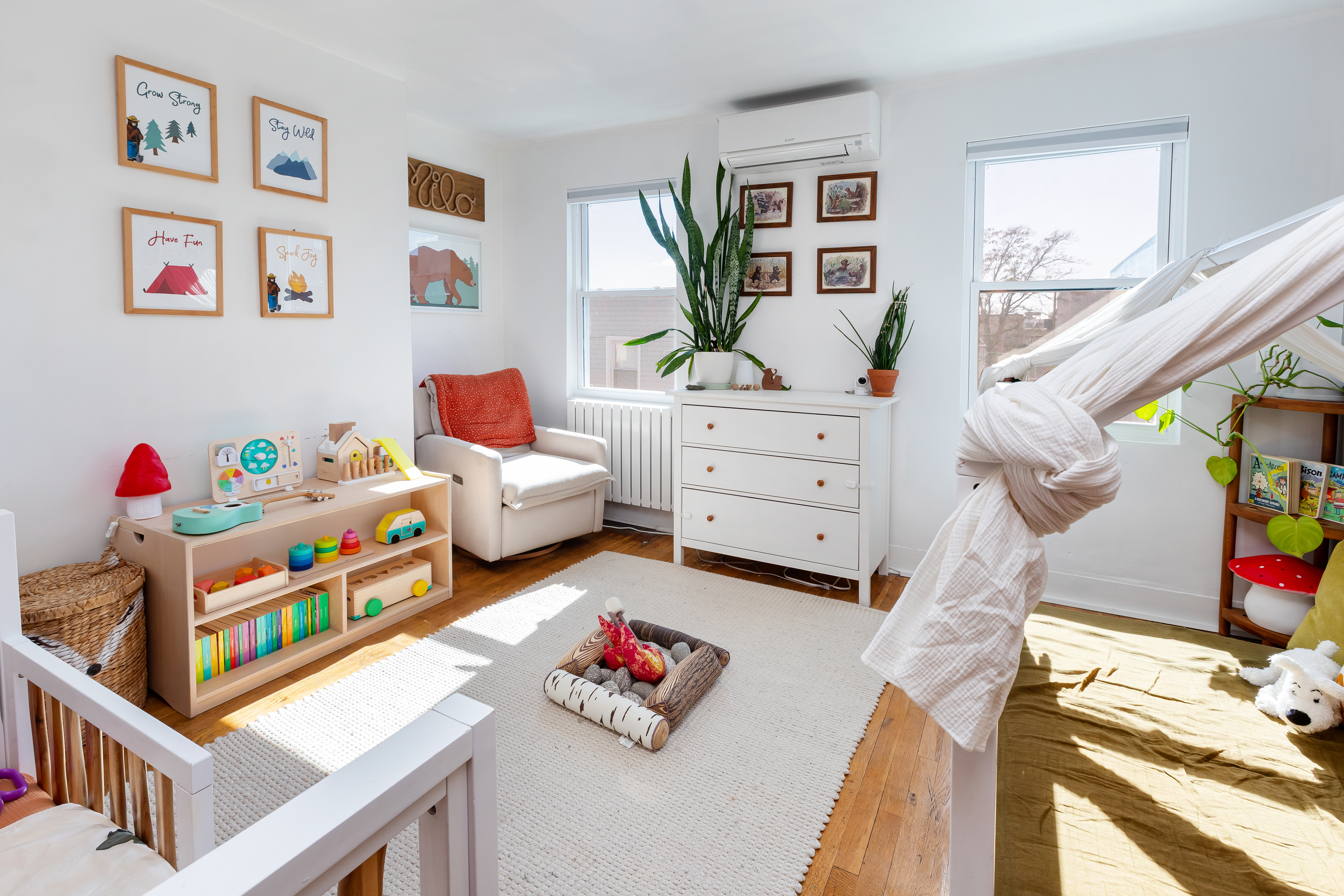 214 Eagle Street Brooklyn, NY 11222 - Photo 10 of 22 a living room with furniture and a baby crib