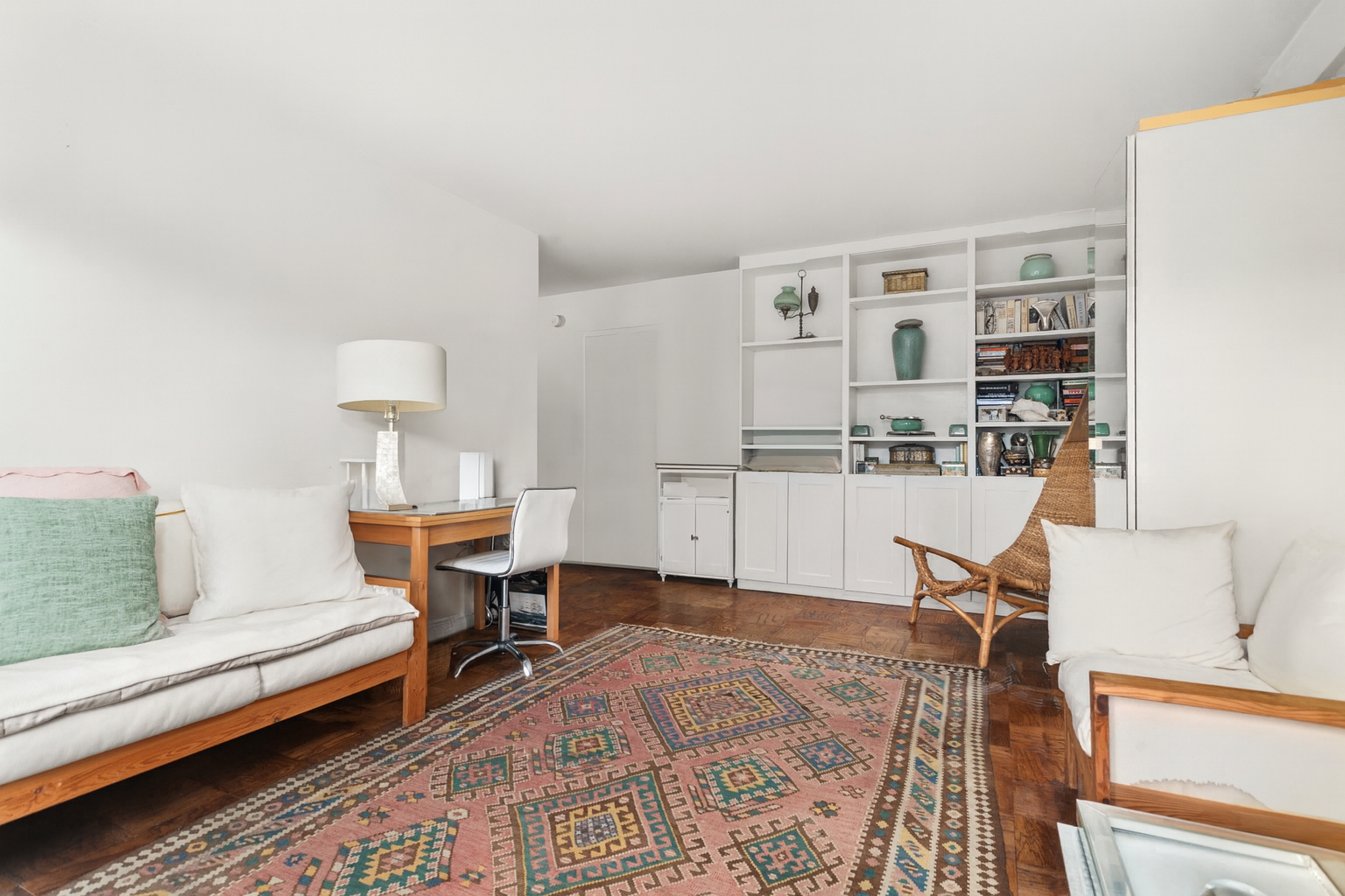 333 East 79th Street, Unit 7P Manhattan, NY 10075 - Photo 3 of 13 a living room with furniture and a table