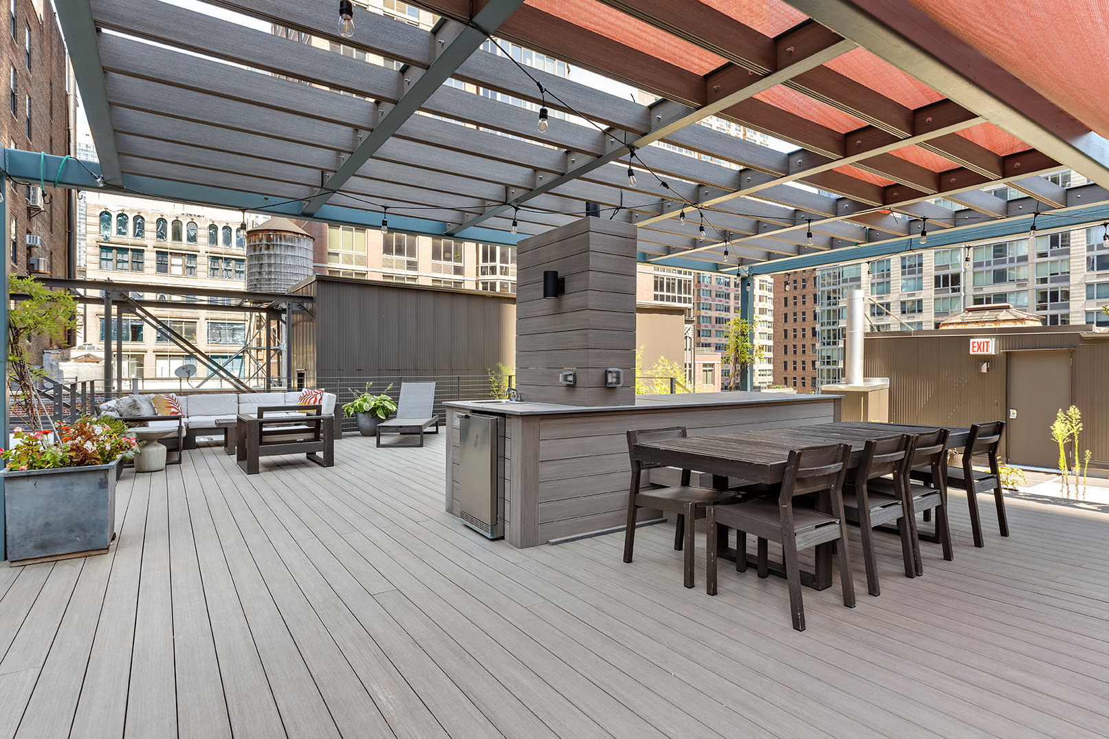 107 West 25th Street, Unit 5B Manhattan, NY 10001 - Photo 15 of 16 a dining room with a wooden table and chairs