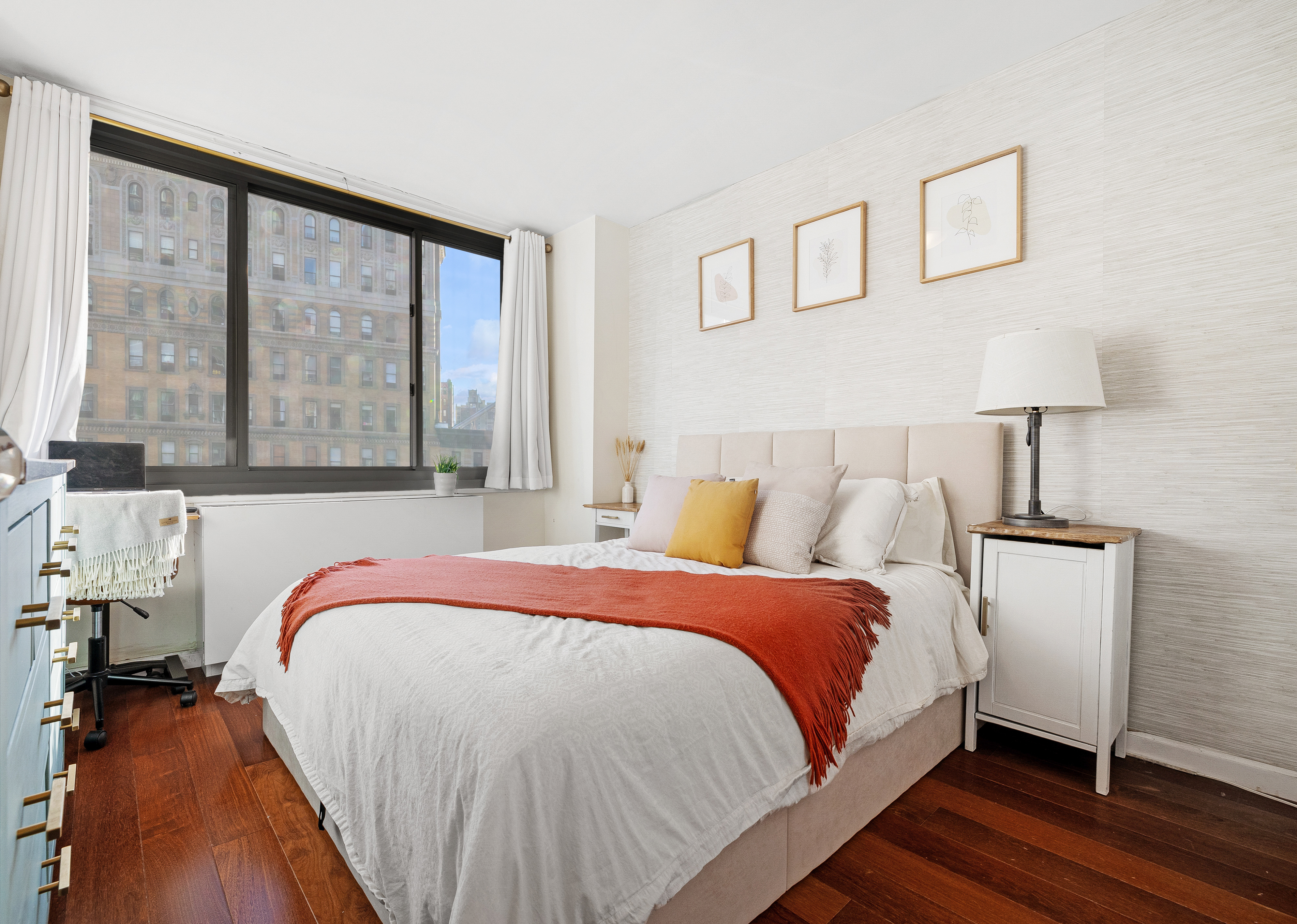 2025 Broadway, Unit 9F Manhattan, NY 10023 - Photo 5 of 11 a bedroom with a bed and a large window