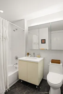 a bathroom with a toilet a sink and bathtub