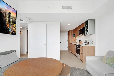 a kitchen with stainless steel appliances a refrigerator and a stove top oven