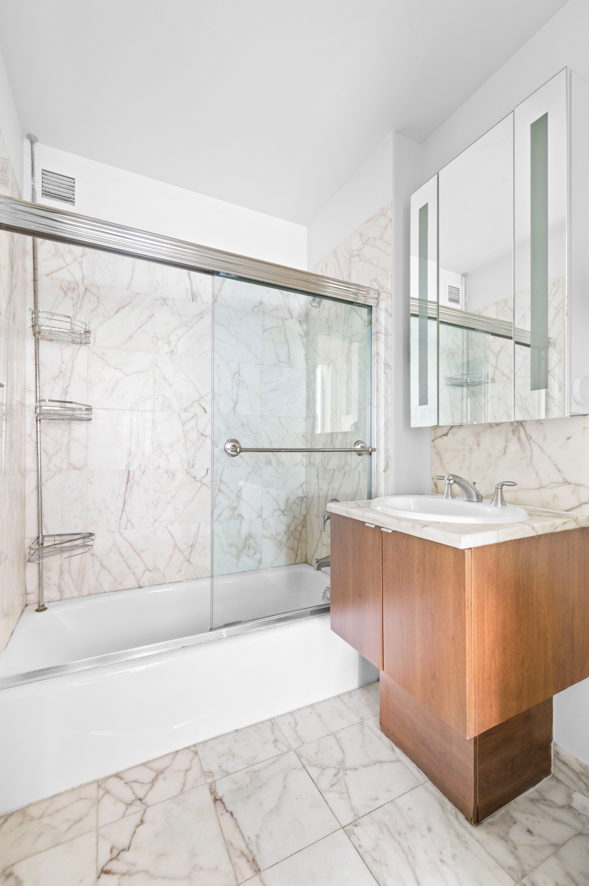 107-24 71st Road, Unit 2E Queens, NY 11375 - Photo 11 of 18 a bathroom with a bathtub and a shower