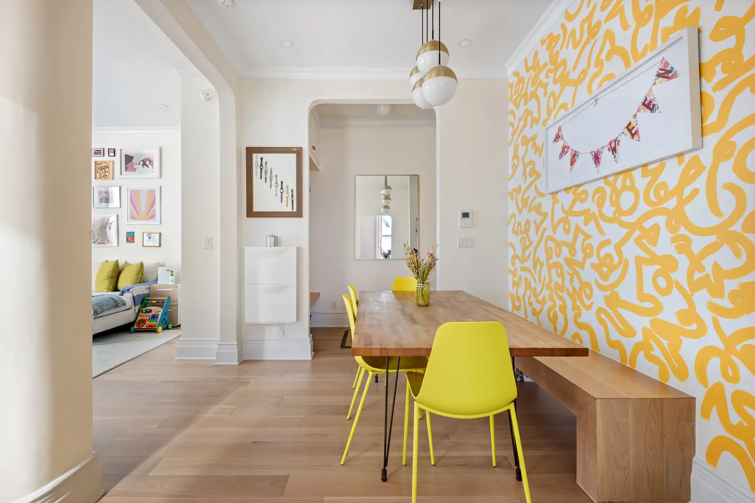 a living room with furniture and a lamp