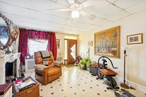 a bedroom with furniture a bed and a chandelier