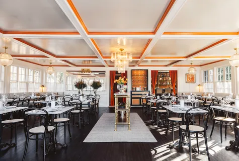 a view of a dining room with lots of tables and chairs