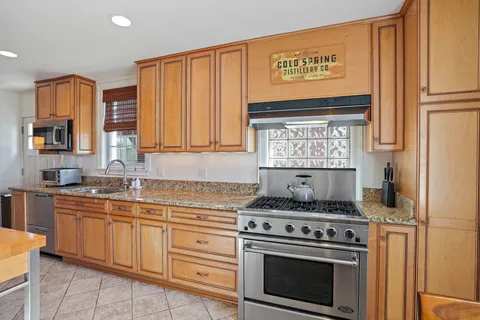 a kitchen with granite countertop lots of counter top space