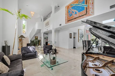 a view of hall way with furniture and entryway