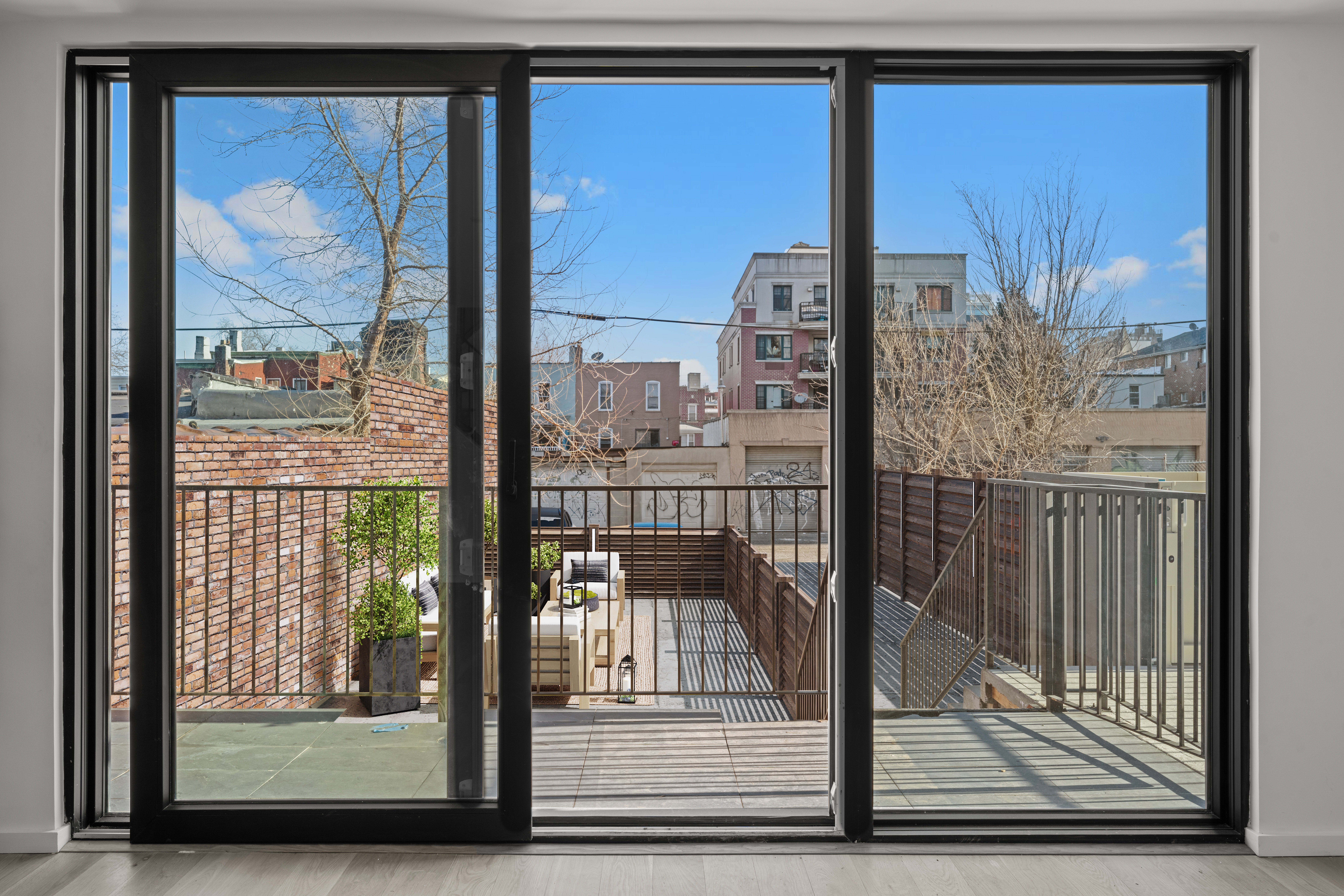 14-35 Broadway, Unit 1A Queens, NY 11106 - Photo 7 of 20 a view of a city from a living room