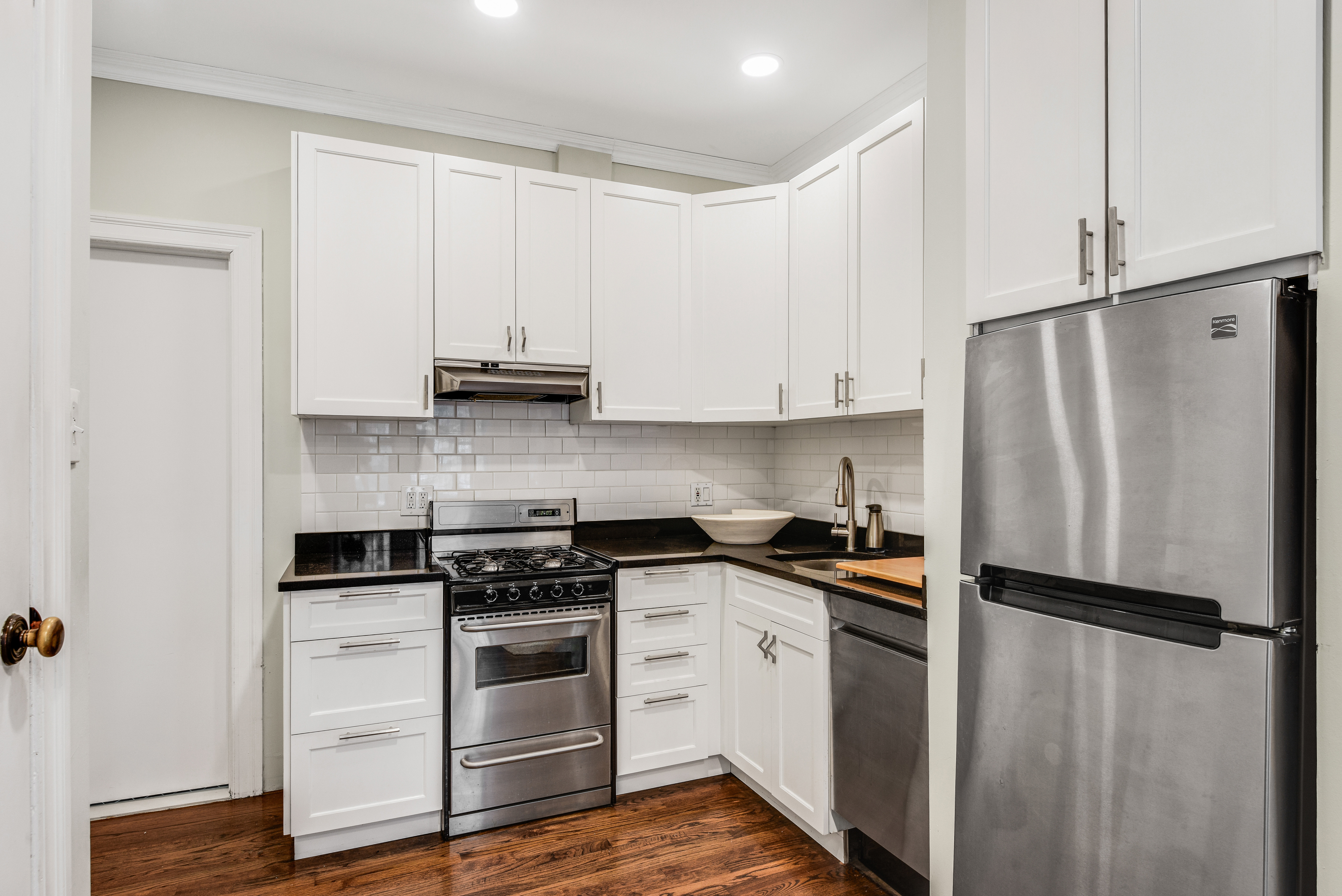 322 6th Street, Unit 2 Brooklyn, NY 11215 - Photo 3 of 11 a kitchen with a white cabinets and white appliances