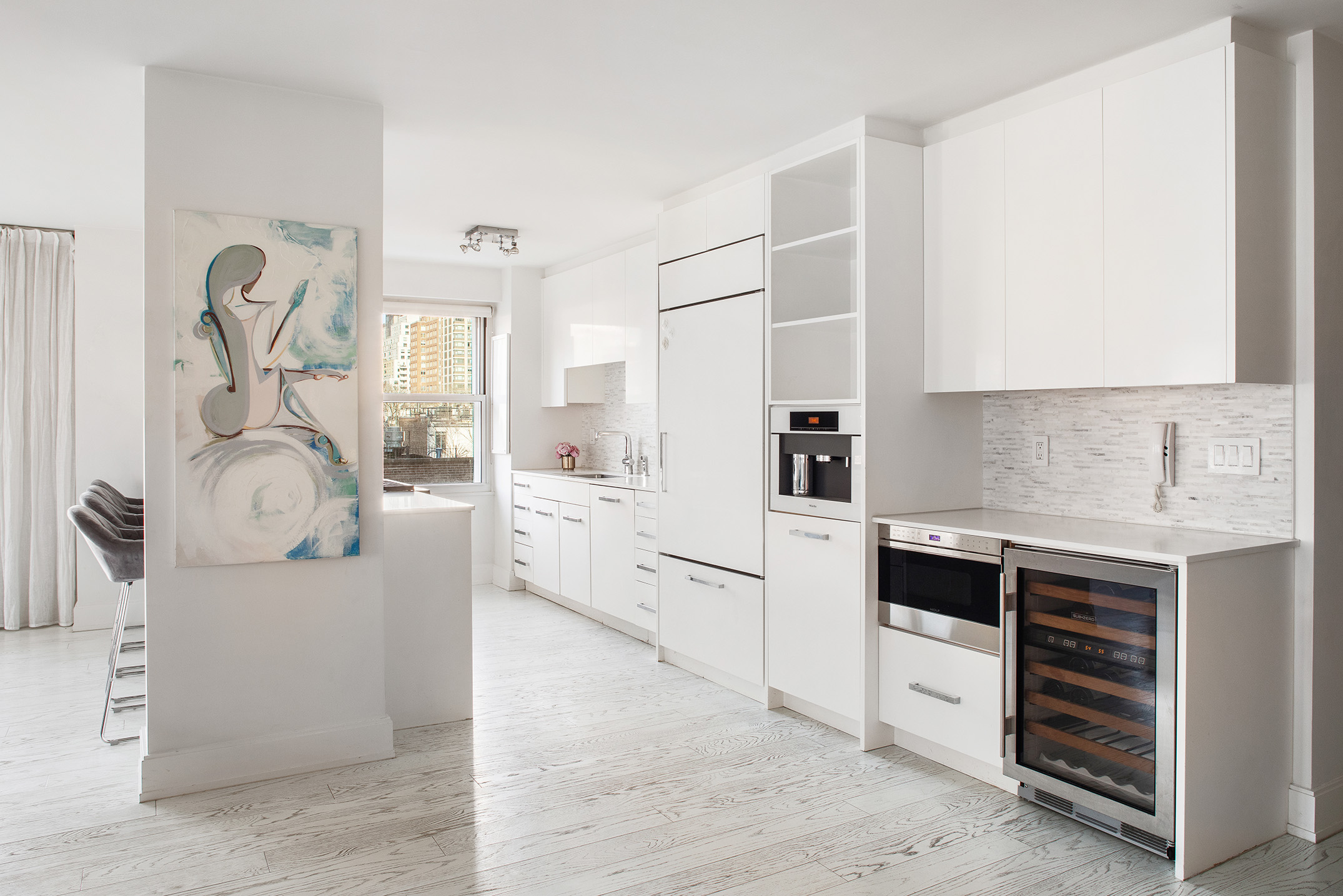 150 East 61st Street, Unit 7E Manhattan, NY 10065 - Photo 4 of 12 a kitchen with cabinets and appliances