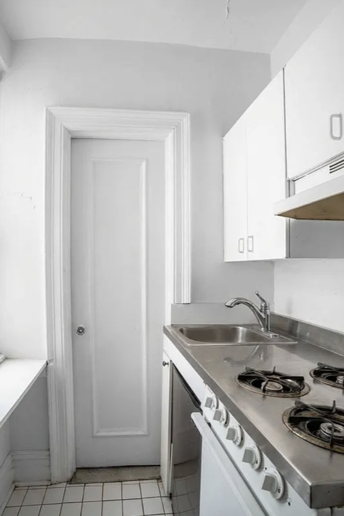 136 East 36th Street, Unit 5E Manhattan, NY 10016 - Photo 3 of 9 a kitchen with a sink stove and cabinets