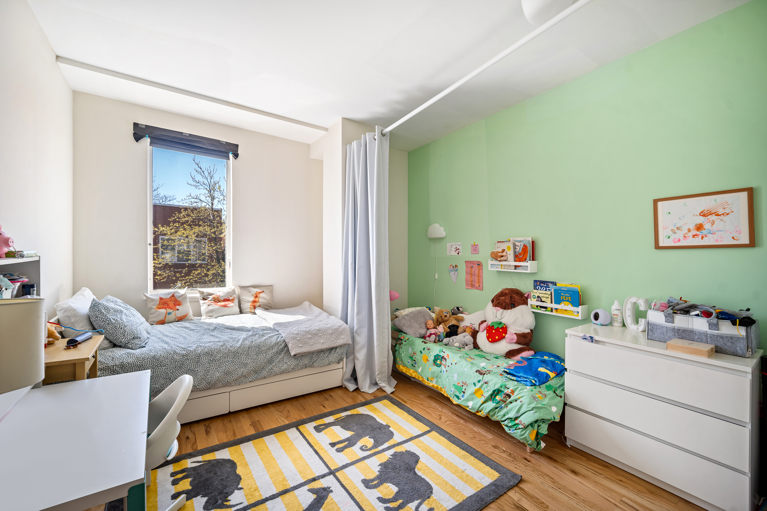 65 Jackson Street Brooklyn, NY 11211 - Photo 31 of 36 a bed room with bed and a window