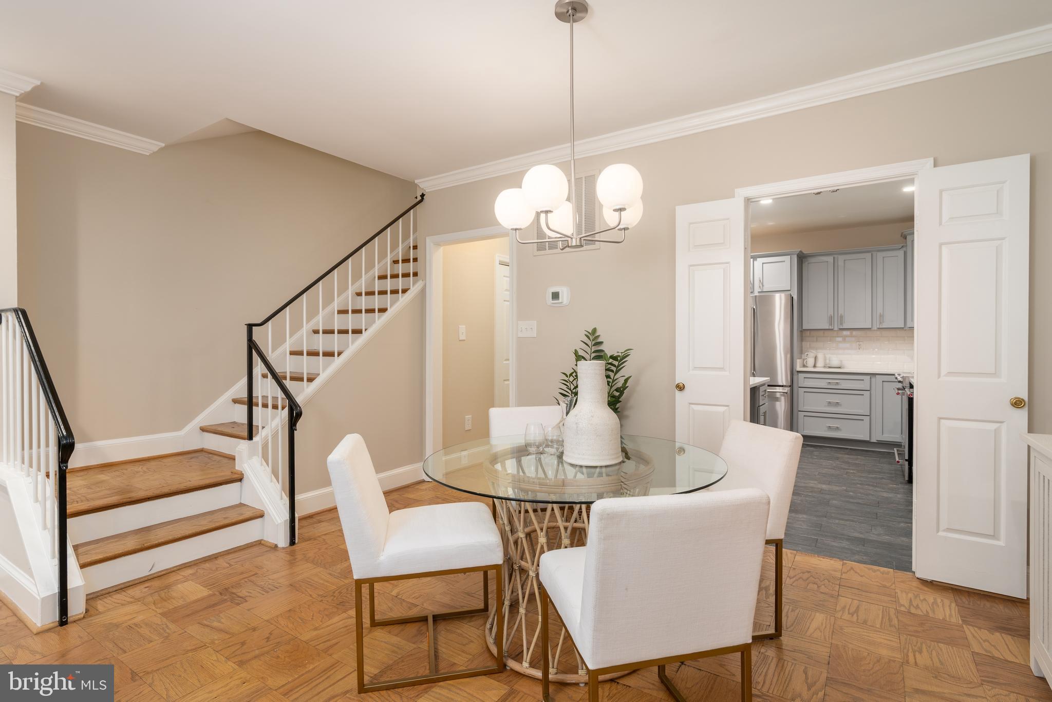 3299 Sutton Place Northwest, Unit C Washington, DC 20016 - Photo 14 of 41 a view of a dining room with furniture and wooden floor