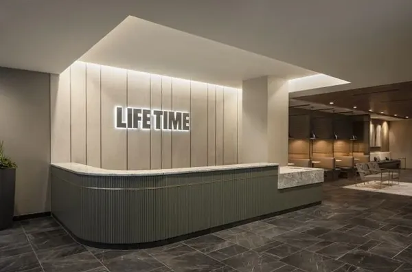 a room with wooden floor and furniture