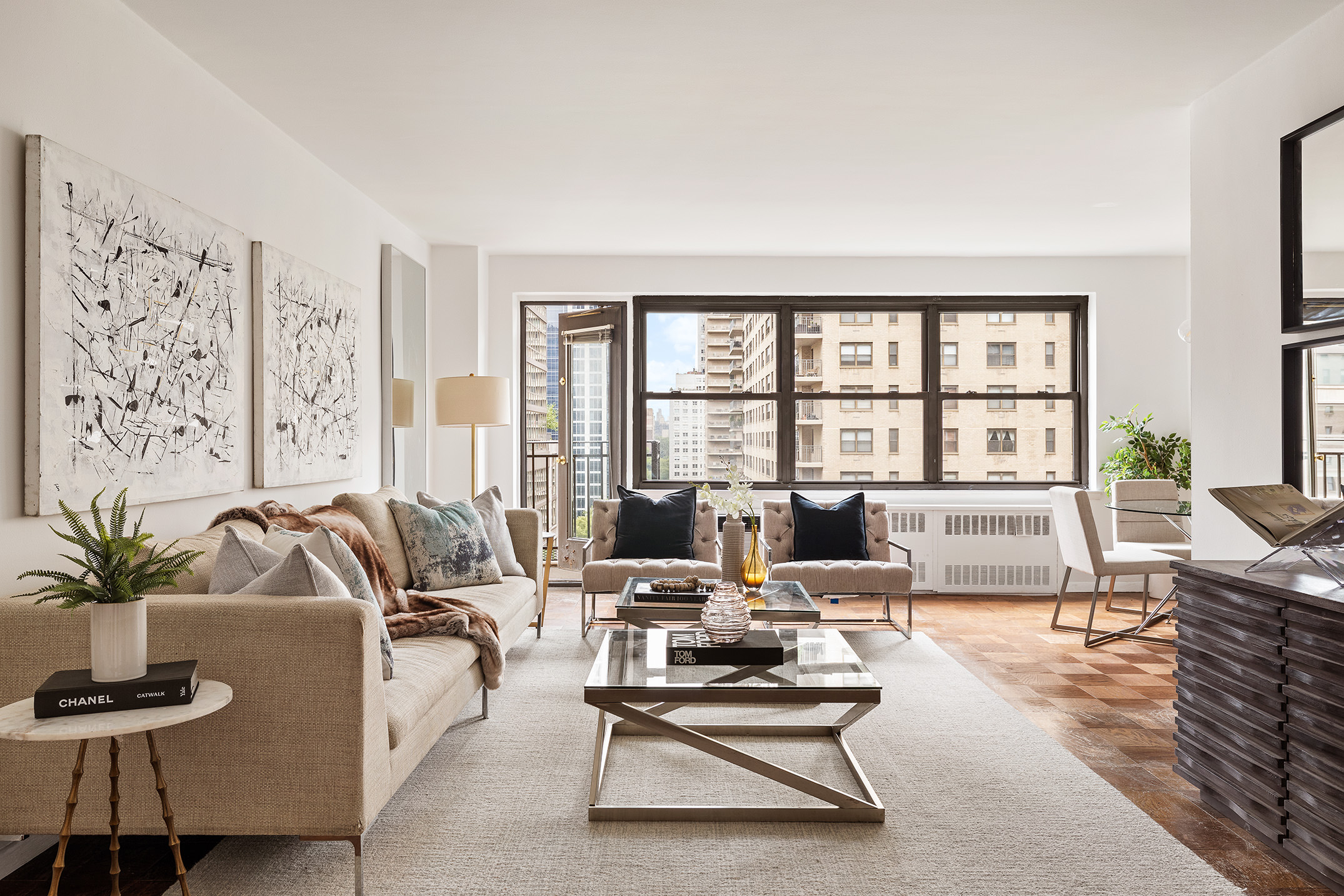 185 West End Avenue, Unit 16D Manhattan, NY 10023 - Photo 1 of 11 a living room with furniture large window and flat screen tv