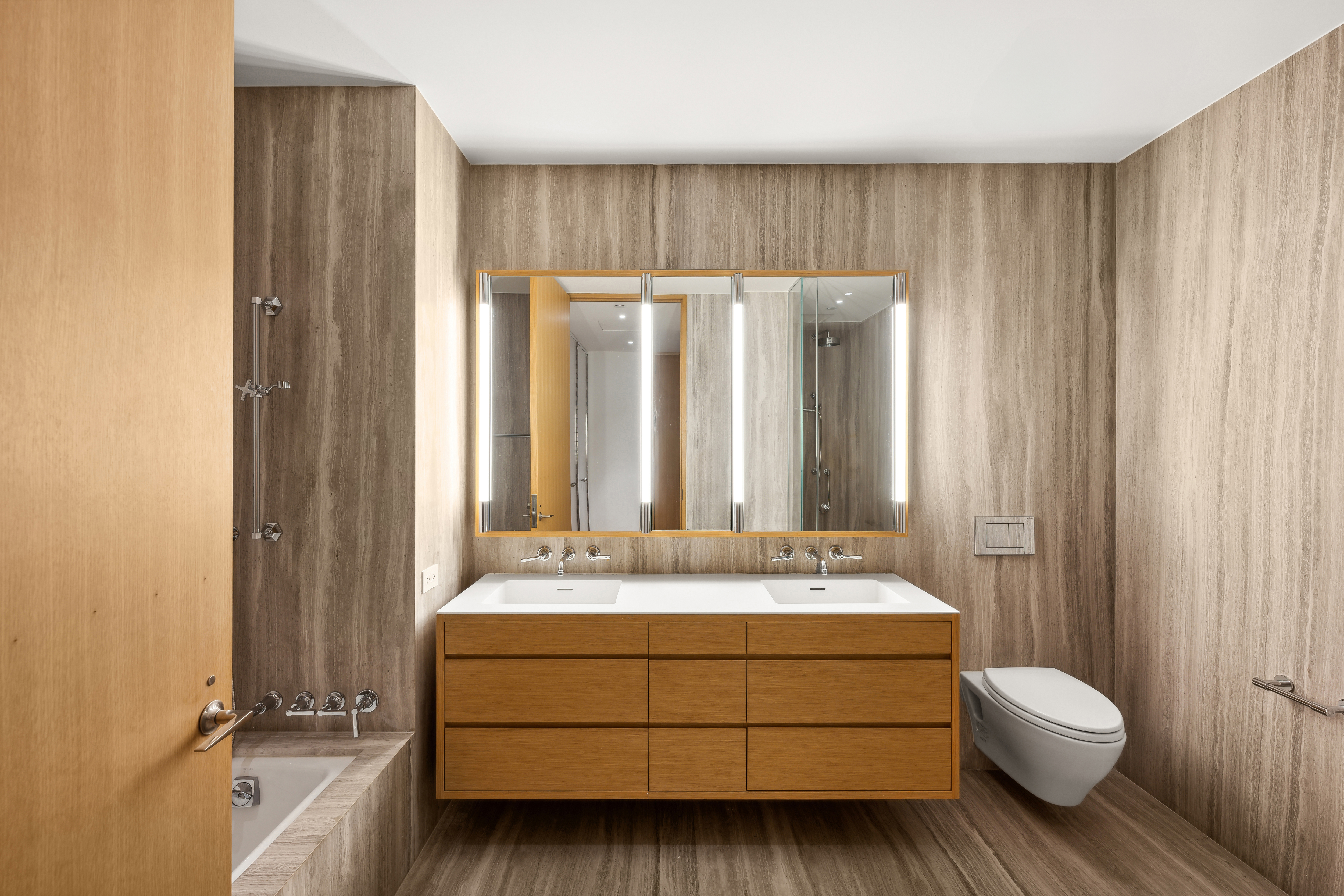 71 Reade Street, Unit 4D Manhattan, NY 10007 - Photo 11 of 15 a bathroom with a sink a toilet and shower