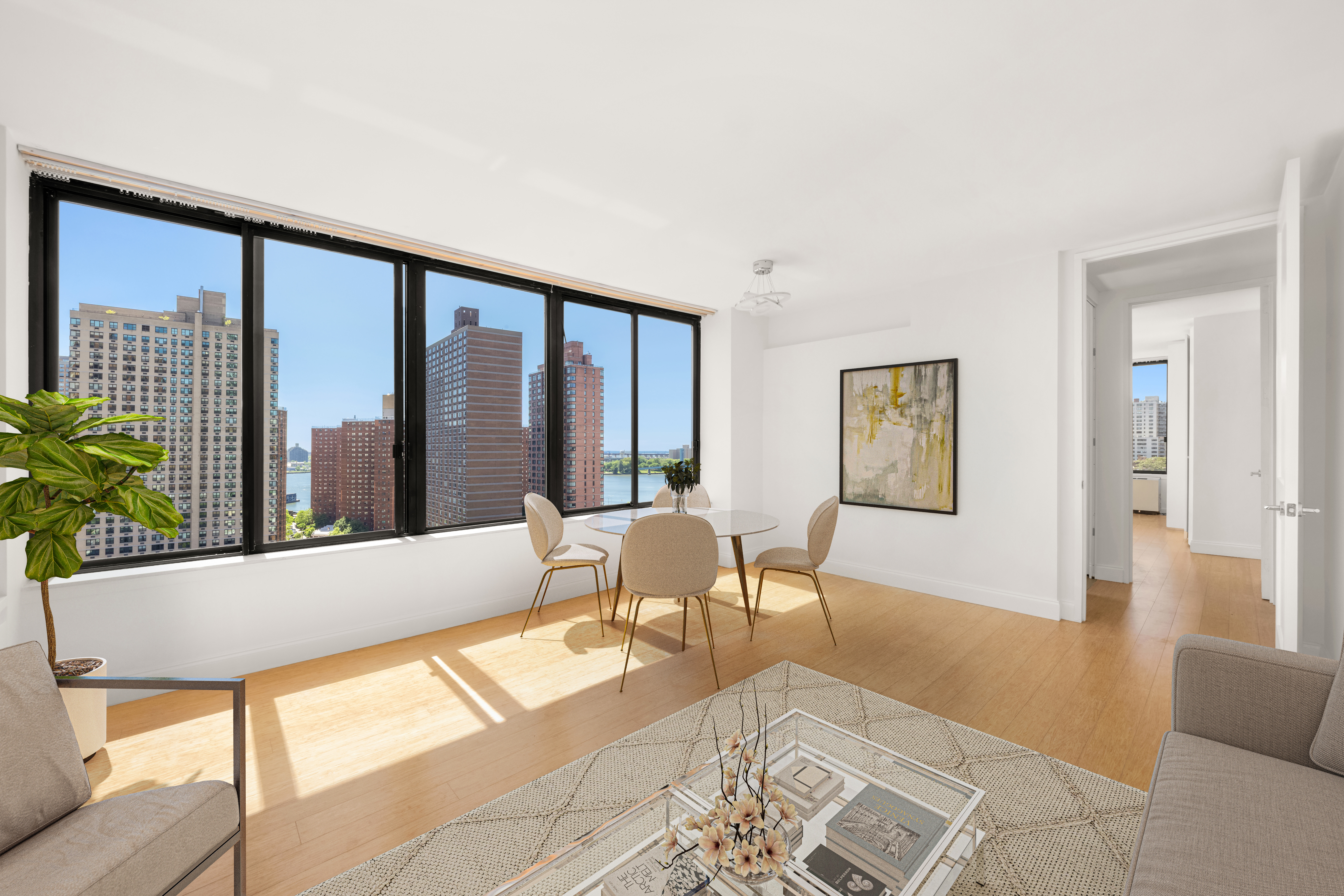 300 East 93rd Street, Unit 18E Manhattan, NY 10128 - Photo 2 of 15 a living room with furniture and a large window