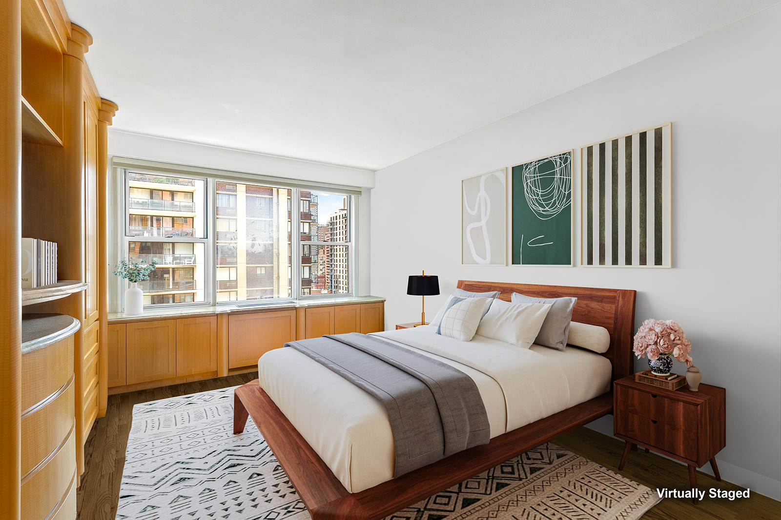 400 East 85th Street, Unit 15F Manhattan, NY 10028 - Photo 6 of 11 a bedroom with a bed and wooden floor