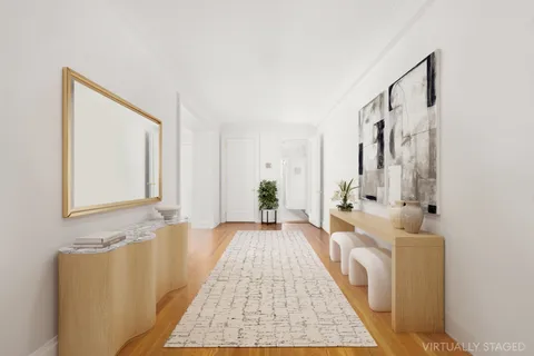 a living room with furniture and a rug